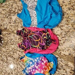 3, Reflectionz brand gymnastic leotards.  Child sizes 6, 8, 10.